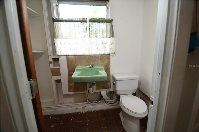 bathroom with toilet and sink