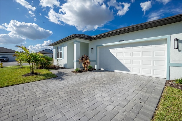 ranch-style house with a front yard and a garage