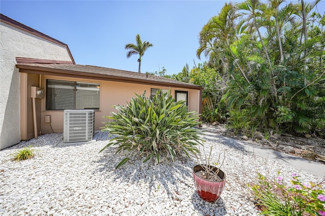 1001 W Marion Ave Unit 14, Punta Gorda, FL 33950 - exterior space featuring central air condition unit and stucco siding