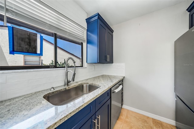 1001 W Marion Ave Unit 14, Punta Gorda, FL 33950 - kitchen with a sink, stainless steel dishwasher, tasteful backsplash, and light stone counters