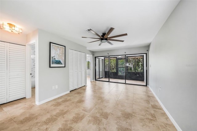 1001 W Marion Ave Unit 14, Punta Gorda, FL 33950 - unfurnished bedroom with visible vents, access to exterior, tile patterned flooring, and baseboards
