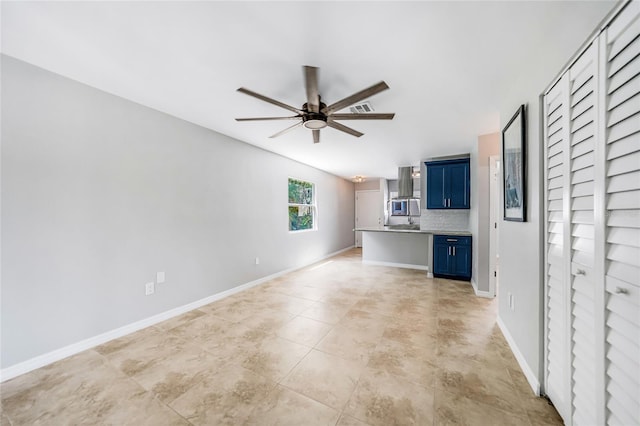 1001 W Marion Ave Unit 14, Punta Gorda, FL 33950 - unfurnished living room featuring ceiling fan, vaulted ceiling, and baseboards
