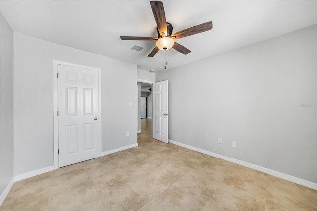 1001 W Marion Ave Unit 14, Punta Gorda, FL 33950 - unfurnished bedroom featuring ceiling fan, baseboards, and visible vents