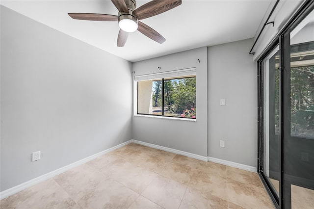 1001 W Marion Ave Unit 14, Punta Gorda, FL 33950 - spare room with light tile patterned floors, baseboards, and a ceiling fan