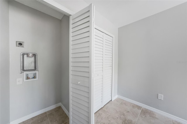 1001 W Marion Ave Unit 14, Punta Gorda, FL 33950 - laundry room featuring laundry area, electric dryer hookup, tile patterned flooring, washer hookup, and baseboards