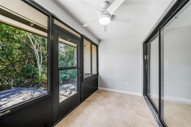 1001 W Marion Ave Unit 14, Punta Gorda, FL 33950 - doorway featuring baseboards, light tile patterned flooring, and ceiling fan