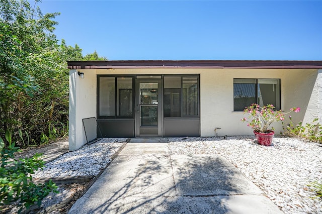 1001 W Marion Ave Unit 14, Punta Gorda, FL 33950 - entrance to property featuring a patio and stucco siding