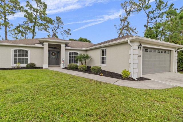 ranch-style home with a garage and a front yard