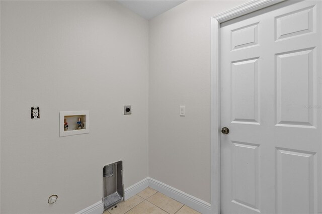 laundry room featuring washer hookup, light tile patterned floors, and electric dryer hookup