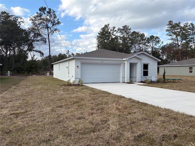 view of front of home with a garage and a front lawn