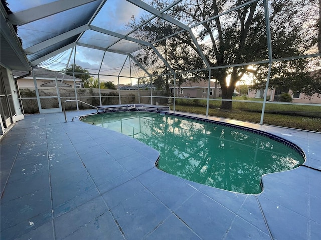 pool at dusk with glass enclosure