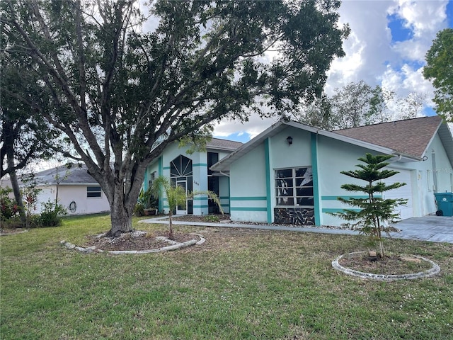 269 Rosemary St, Port Charlotte, FL 33954 - view of front of property featuring stucco siding, an attached garage, a front yard, and a shingled roof