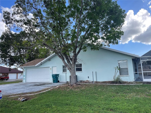 view of property exterior with a lawn and a garage