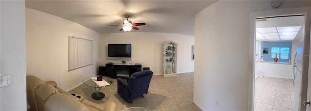 tiled living room featuring lofted ceiling and ceiling fan