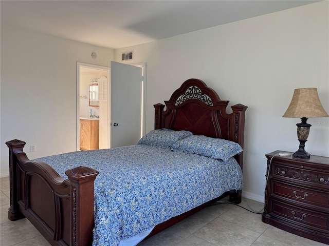 bedroom with light tile patterned floors