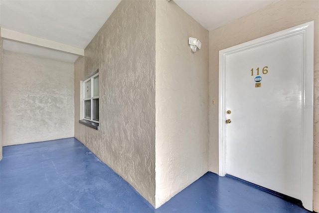 view of exterior entry with stucco siding