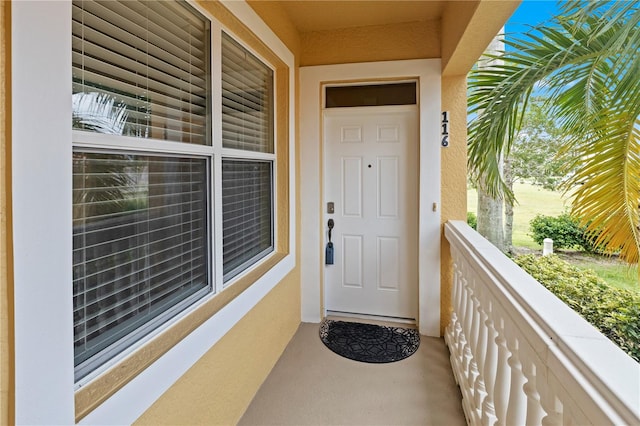 doorway to property featuring a balcony