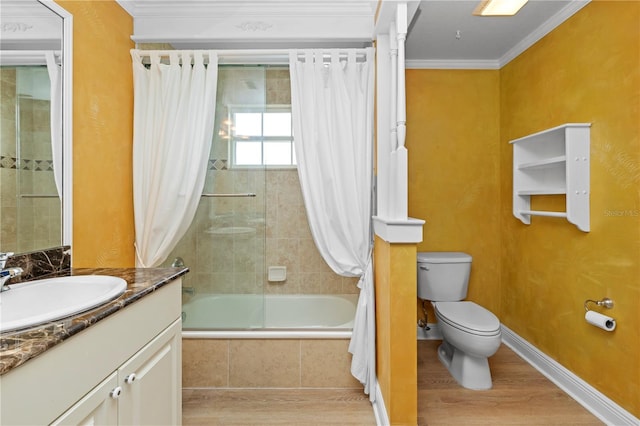 full bathroom featuring vanity, hardwood / wood-style floors, toilet, ornamental molding, and shower / bath combo with shower curtain