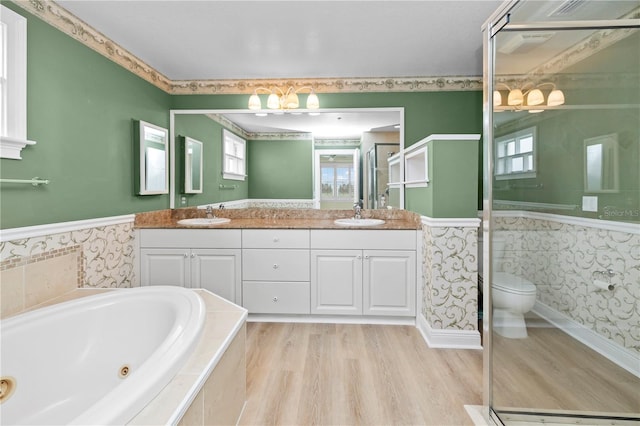 full bathroom featuring vanity, toilet, independent shower and bath, and hardwood / wood-style floors