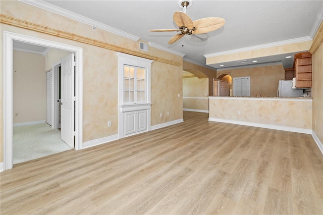 unfurnished living room featuring crown molding, ceiling fan, and hardwood / wood-style floors