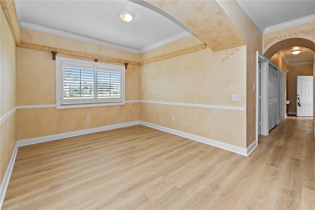 spare room featuring ornamental molding and wood-type flooring