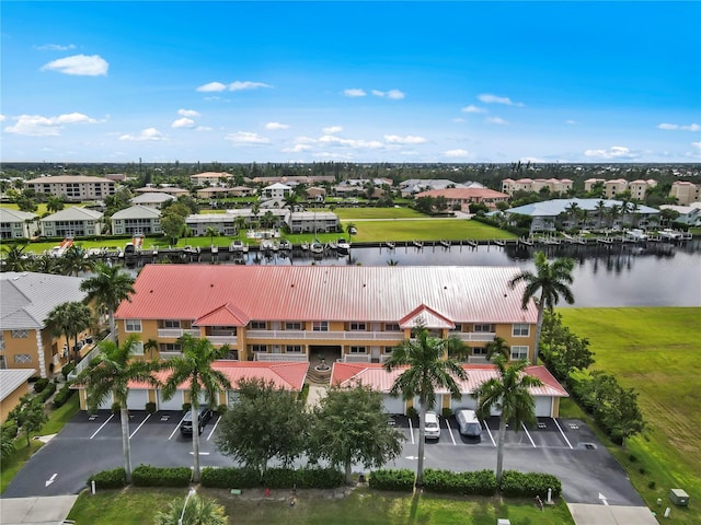 birds eye view of property featuring a water view