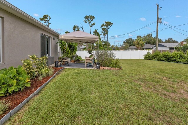 view of yard featuring a gazebo and a patio area