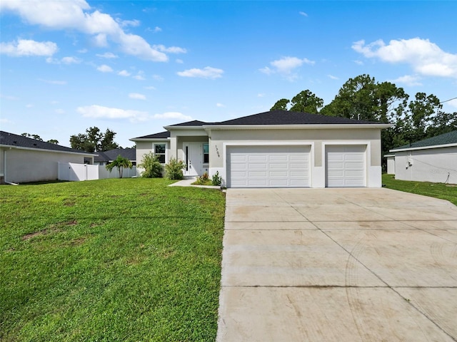 view of front facade featuring a garage and a front yard