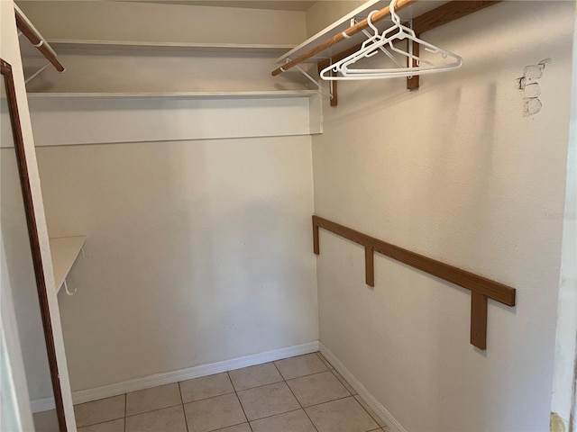 walk in closet featuring light tile patterned floors