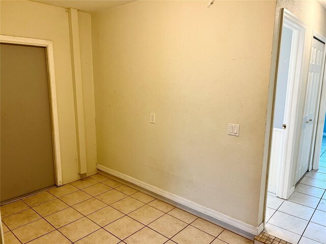 unfurnished bedroom featuring light tile patterned floors