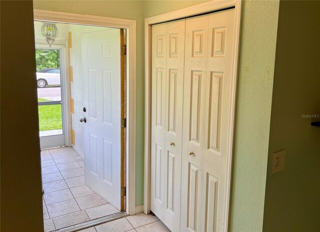 corridor with light tile patterned floors