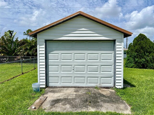 garage featuring a yard