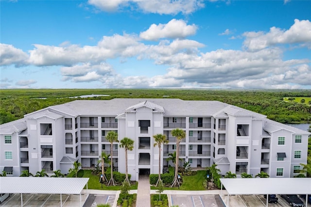 14131 Heritage Landing Blvd Unit 838, Punta Gorda, FL 33955 - view of building exterior featuring uncovered parking