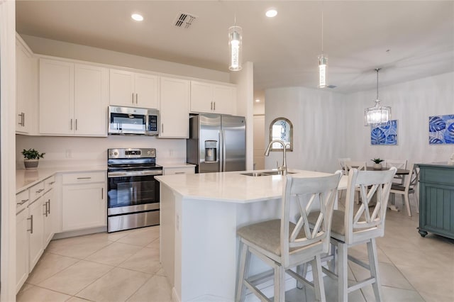 14131 Heritage Landing Blvd Unit 838, Punta Gorda, FL 33955 - kitchen with visible vents, appliances with stainless steel finishes, light tile patterned flooring, and light countertops