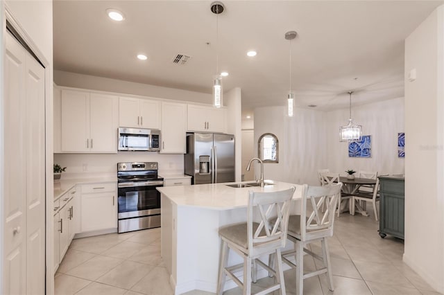 14131 Heritage Landing Blvd Unit 838, Punta Gorda, FL 33955 - kitchen with visible vents, a sink, appliances with stainless steel finishes, light countertops, and light tile patterned floors