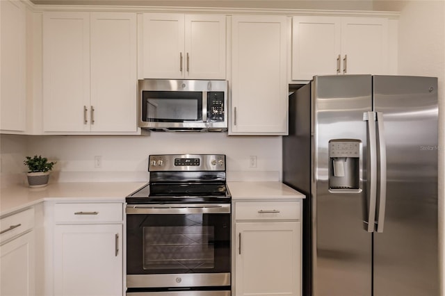 14131 Heritage Landing Blvd Unit 838, Punta Gorda, FL 33955 - kitchen featuring white cabinetry, light countertops, and appliances with stainless steel finishes