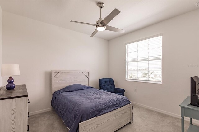 14131 Heritage Landing Blvd Unit 838, Punta Gorda, FL 33955 - bedroom featuring ceiling fan, baseboards, and light carpet