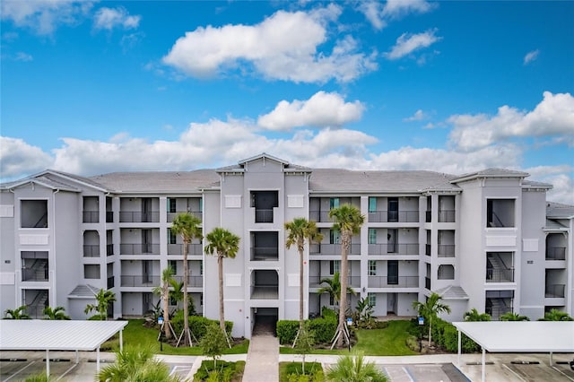 14131 Heritage Landing Blvd Unit 838, Punta Gorda, FL 33955 - view of building exterior featuring uncovered parking