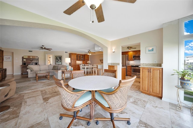 dining area with ceiling fan