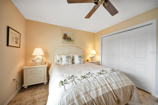 bedroom with ceiling fan and a closet