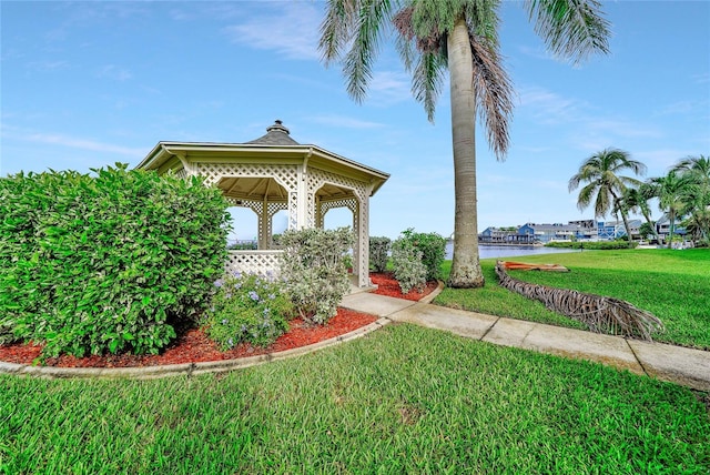 view of home's community with a lawn and a gazebo