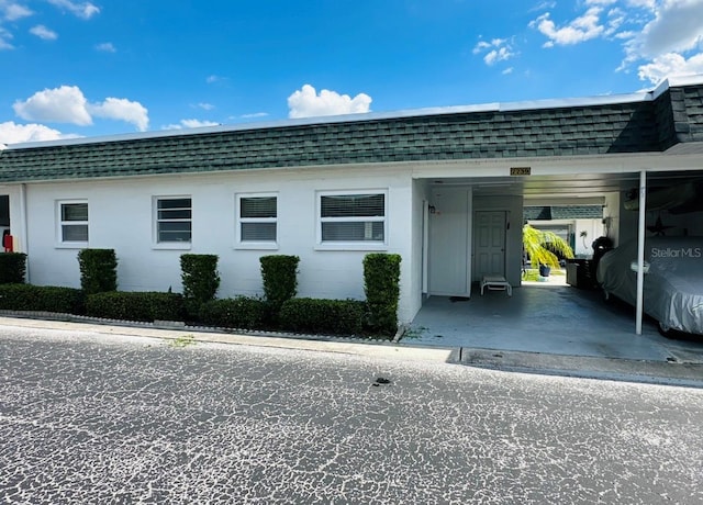 exterior space with a carport