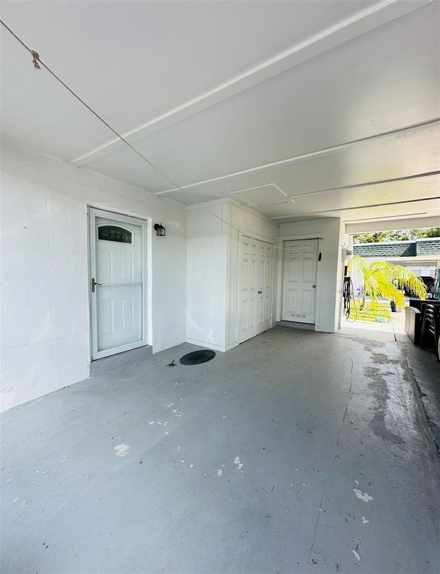 garage with concrete block wall