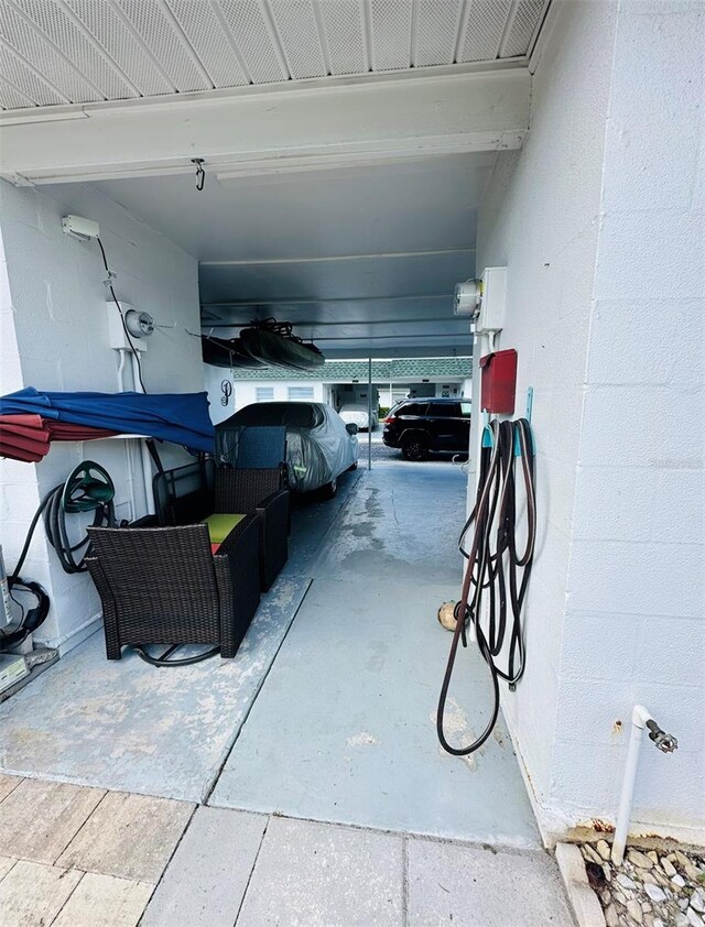 garage featuring a carport