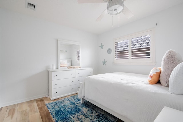 bedroom featuring ceiling fan and light hardwood / wood-style floors