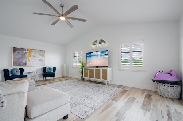 living room featuring light wood-type flooring, ceiling fan, and lofted ceiling