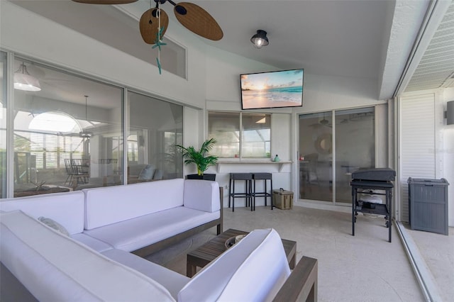 interior space featuring ceiling fan and concrete flooring