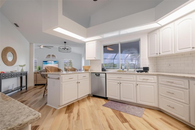 kitchen with dishwasher, light hardwood / wood-style floors, kitchen peninsula, white cabinetry, and ceiling fan