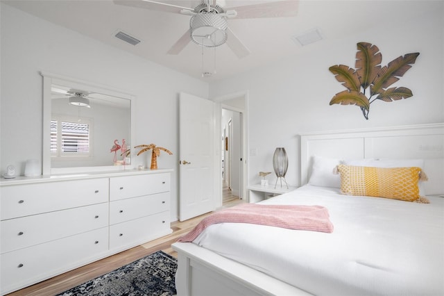 bedroom with light hardwood / wood-style flooring and ceiling fan