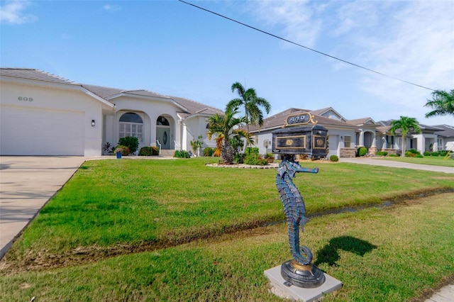 view of front of property featuring a garage and a front yard